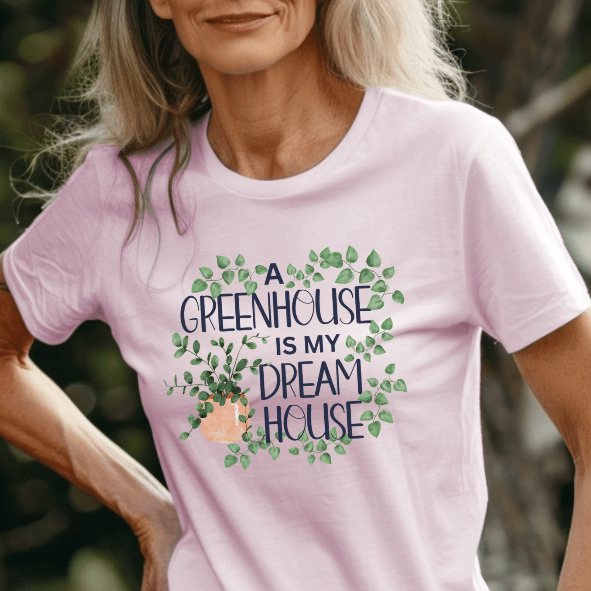 Woman wearing a pink gardening t-shirt for plant lovers and greenhouse enthusiasts