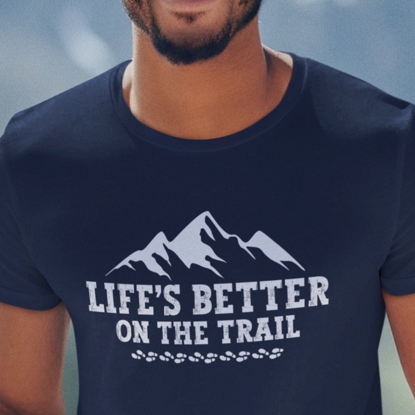 Guy wearing a Hiking t-shirt that says Life's Better on the Trail