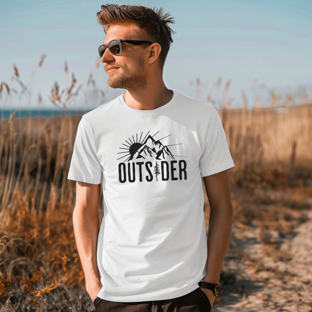 A guy wearing a nature hiking tee shirt that says, Outsider