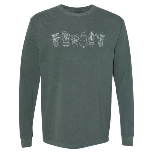 Green Long Sleeve t-shirt for gardeners and cat lovers that has a design of potted plants on a shelf with a kitty sitting among them