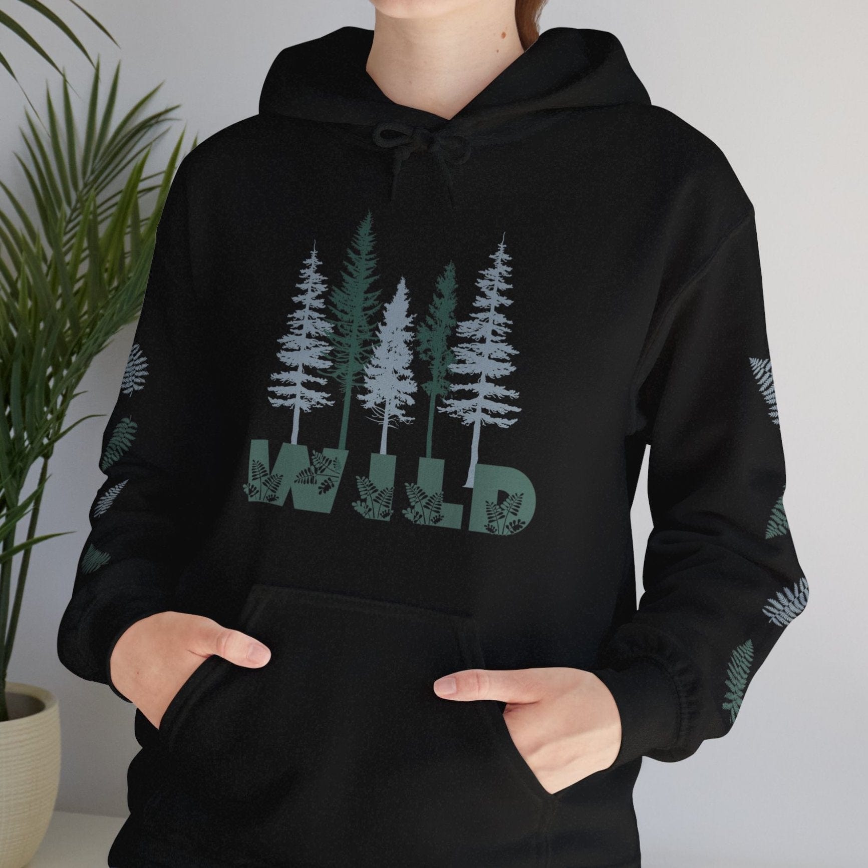 Black nature lover's hoodie with pine trees and says WILD